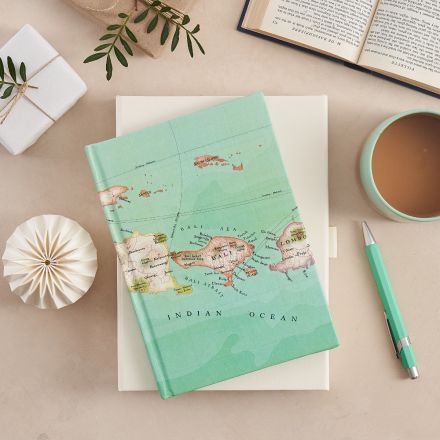 Bali map notebook in light mint green with a cup of tea