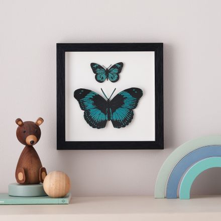 3d papercut butterflies handpainted in metallic blue. Mounted in white wood box frame.