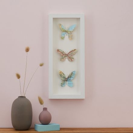 Three map location butterflies artwork, white frame, portrait orientation.