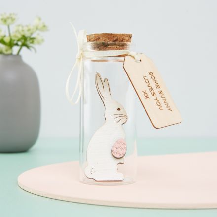White bunny in a miniature bottle with personalised engraved tag.