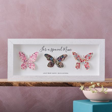 Three map location butterflies artwork, white frame, landscape orientation.