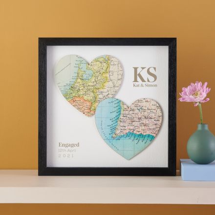 Two map hearts in black box frame with printed personalisation.