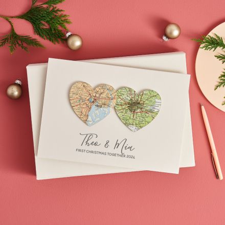 Personalised romantic Christmas card with two map hearts and printed message beneath