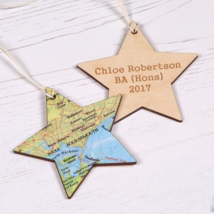 Hanging wooden star shaped keepsake with map on one side and engraving on the other.