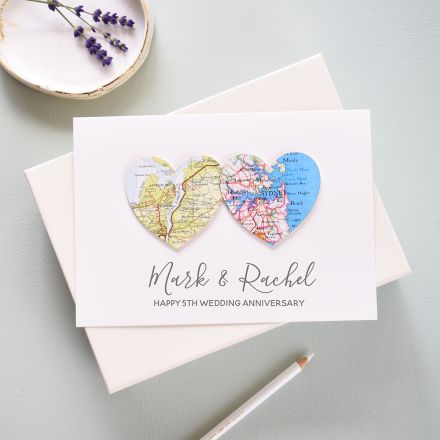 Two map location hearts mounted on white card personalised with couples names