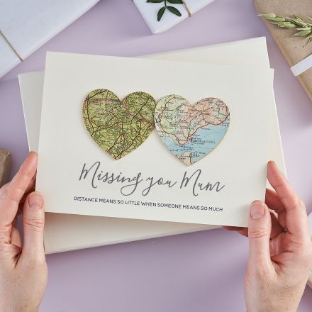 Card with two map hearts with different locations and 'Missing you Mum' printed beneath.