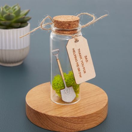 handpainted spade in miniature glass bottle with personalised tag.