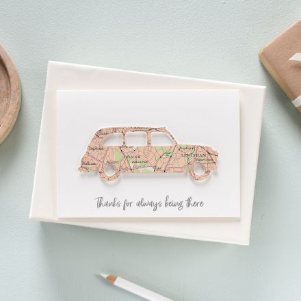 White card featuring a taxi silhouette cut from London map with 'Dad's taxi' printed beneath.