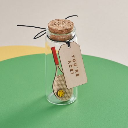 A miniature Tennis racket in a glass bottle. Personalised sport themed gift 
