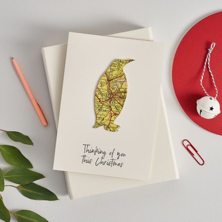Map stag's head silhouette mounted on brown card with 'Thinking of you this Christmas' printed below.