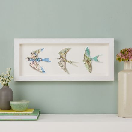 Three map location birds in landscape light wood box frame.