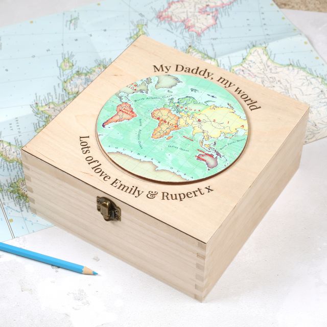 Wooden box with map disc on lid and the words 'My Daddy, my word, lots of love Emily and Rupert' engraved around it.