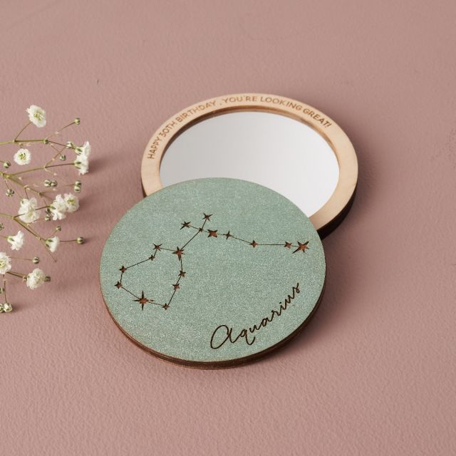 Pocket mirror with star sign constellation engraving and personalisation around mirrors edge.