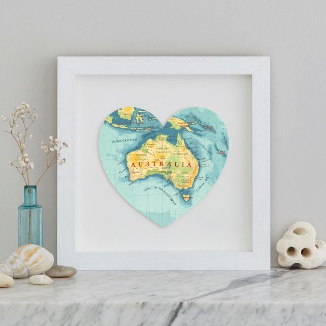 Blue, yellow and green map of Austtalia in a white box frame