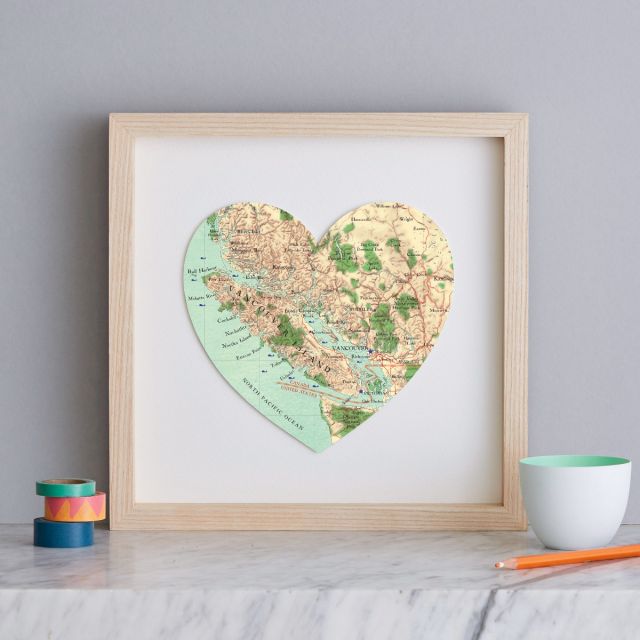 Vancouver map heart print with light wood frame.
