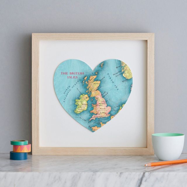 British Isles map heart print in light wood frame.