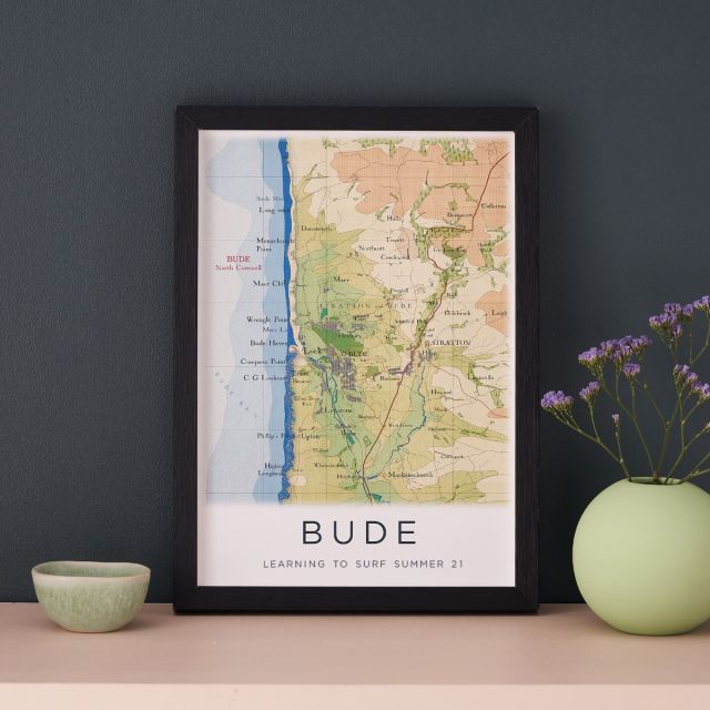 Hand-drawn map print of Bude, Cornwall personalised with text below map. Framed in black box frame.