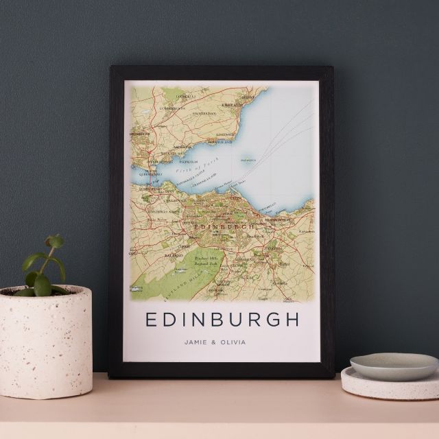 Hand-drawn map print of Edinburgh personalised with text below map. Framed in black box frame.
