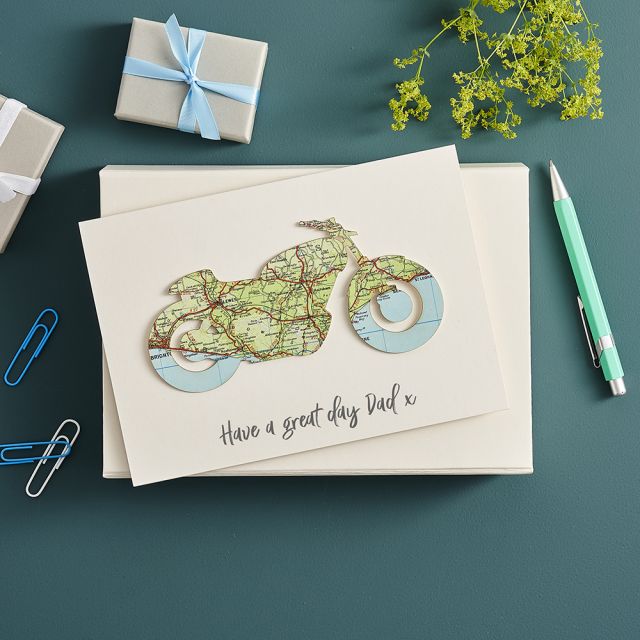 Motorbike silhouette cut from map and mounted on white card printed with 'have a great day dad'
