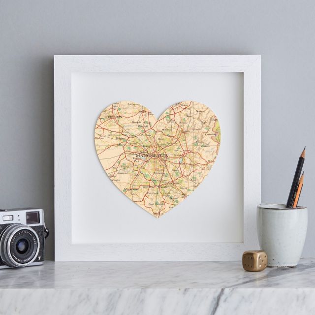 Map heart of Manchester in white box frame.