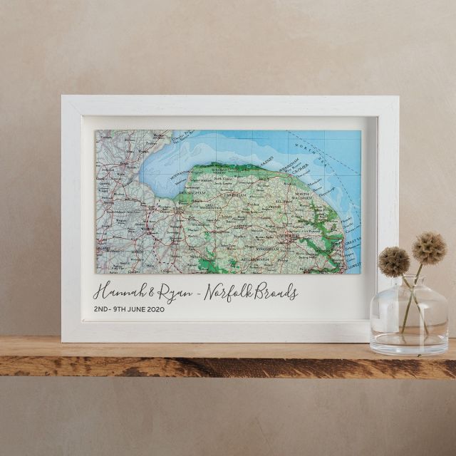 Landscape custom map of Norfolk, mounted on white card with 'Hannah & Ryan - Norfolk Borads, 2nd - 9th June 2020' printed beneath map. White wood frame.
