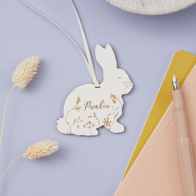 Rabbit keepsake decoration on white ribbon