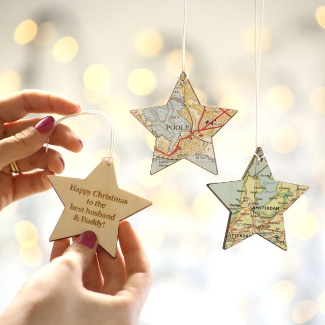 three hanging map star keepsakes. One showing back of map star with engraving 'Happy Christmas to the best husband and Daddy'.